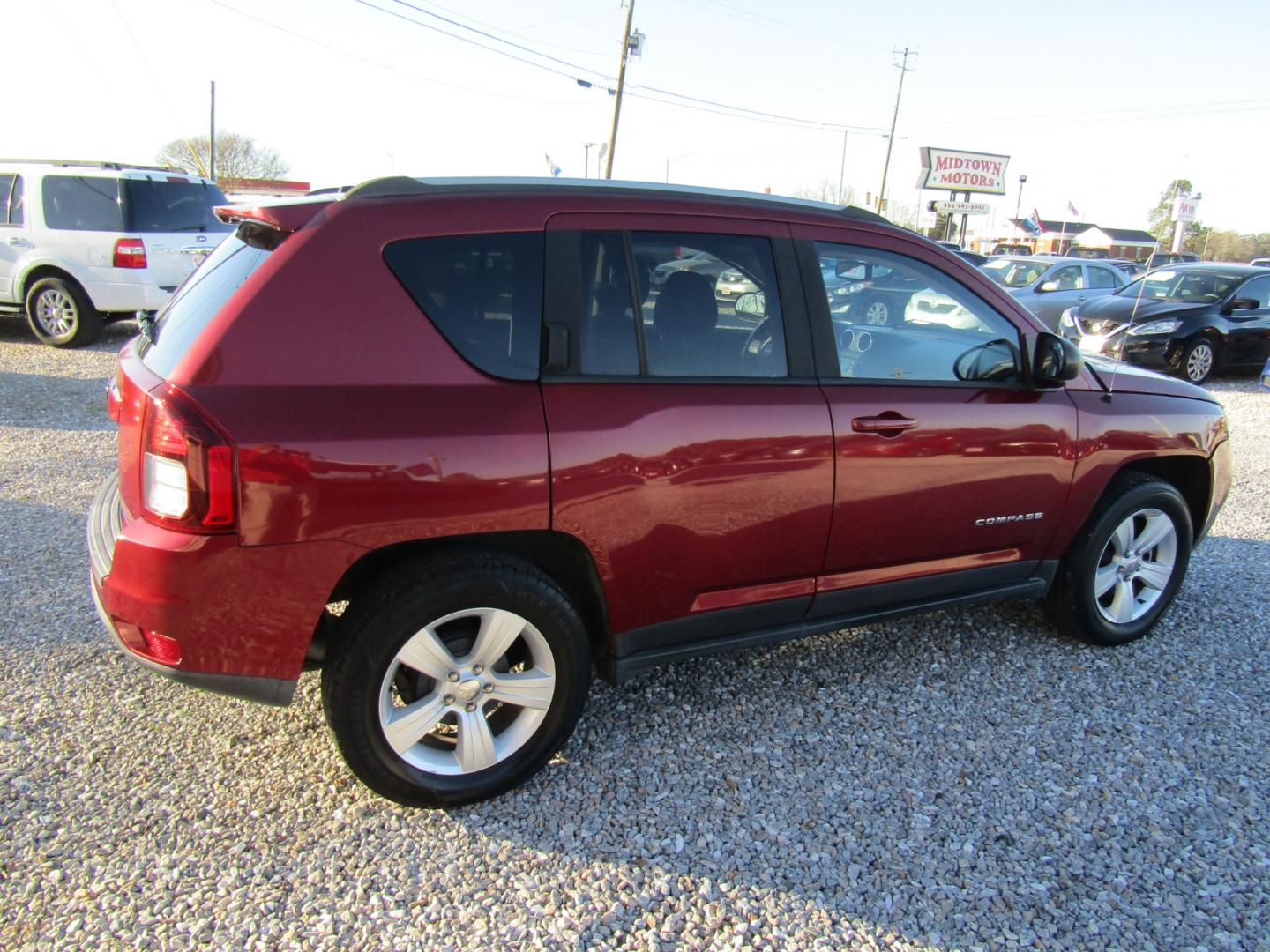 2016 Red /Gray Jeep Compass Sport FWD (1C4NJCBA3GD) with an 2.0L L4 DOHC 16V engine, Automatic transmission, located at 15016 S Hwy 231, Midland City, AL, 36350, (334) 983-3001, 31.306210, -85.495277 - Photo#7